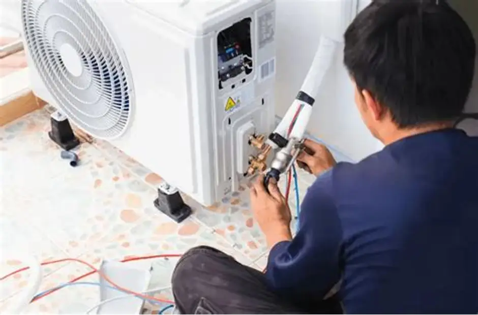 HVAC Technician Inspecting Electrical Controls During Air Conditioning Repair in Dentsville, MD
