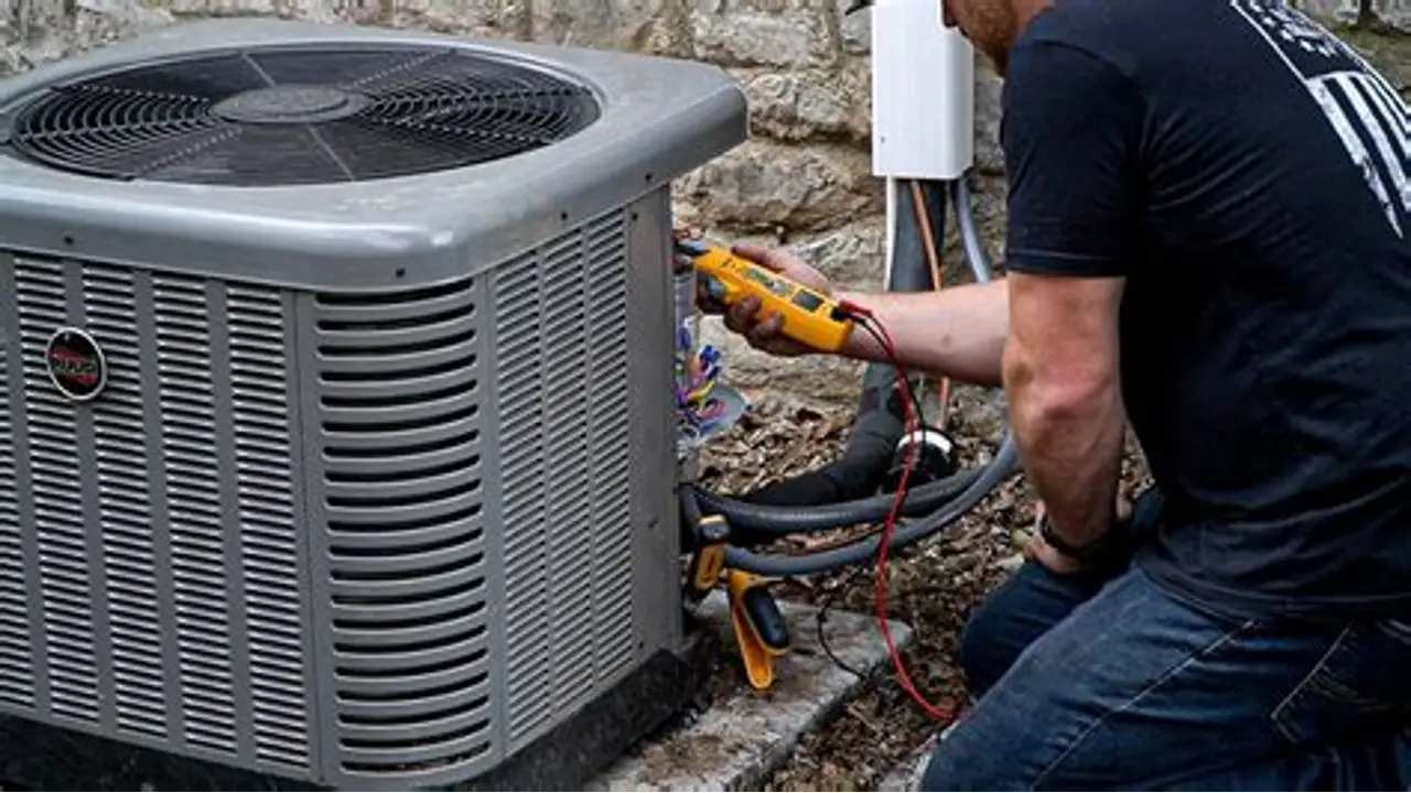 Technician Checking Electrical Components During Air Conditioning Repair in Clinton, MD