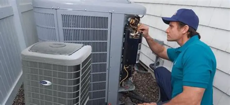Technician Checking an Outdoor AC Unit During Air Conditioning Repair in Hyattsville, MD